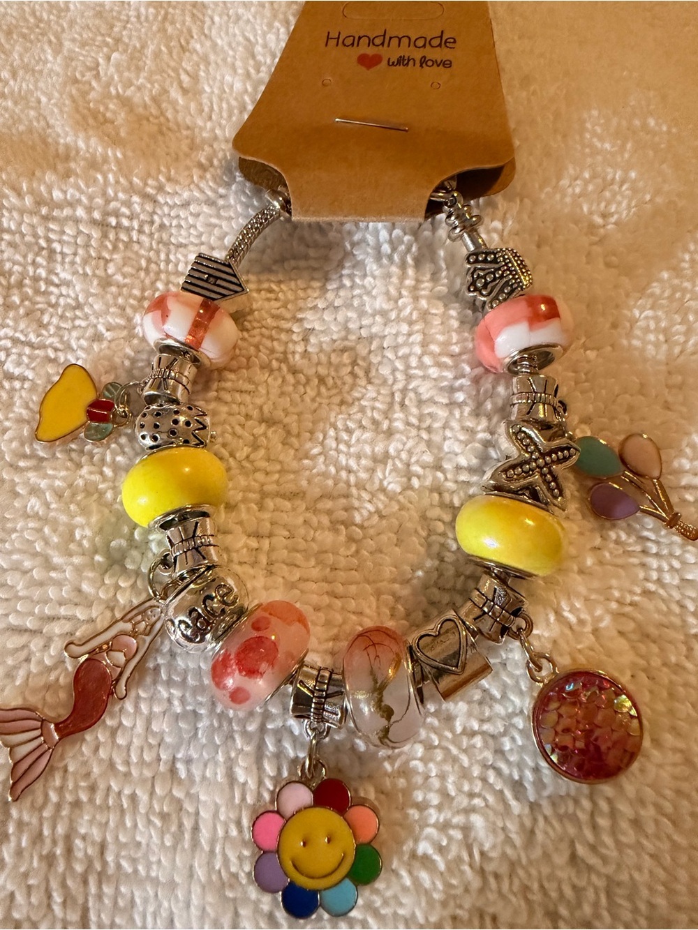 Handmade Women's Charm Bracelet in Yellow & Pink with Smiley Flower Charm